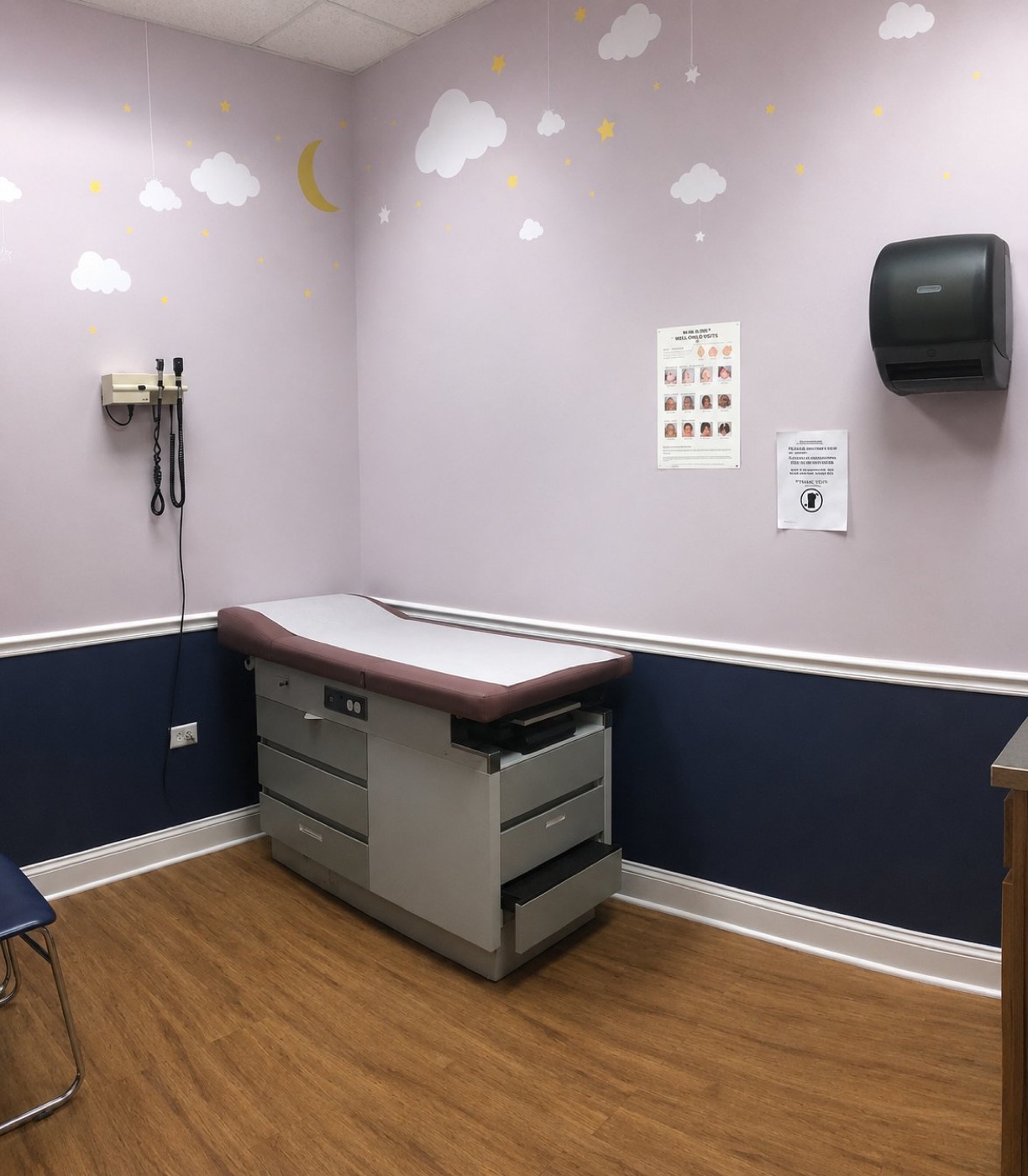 Exam room with clouds and stars on the walls