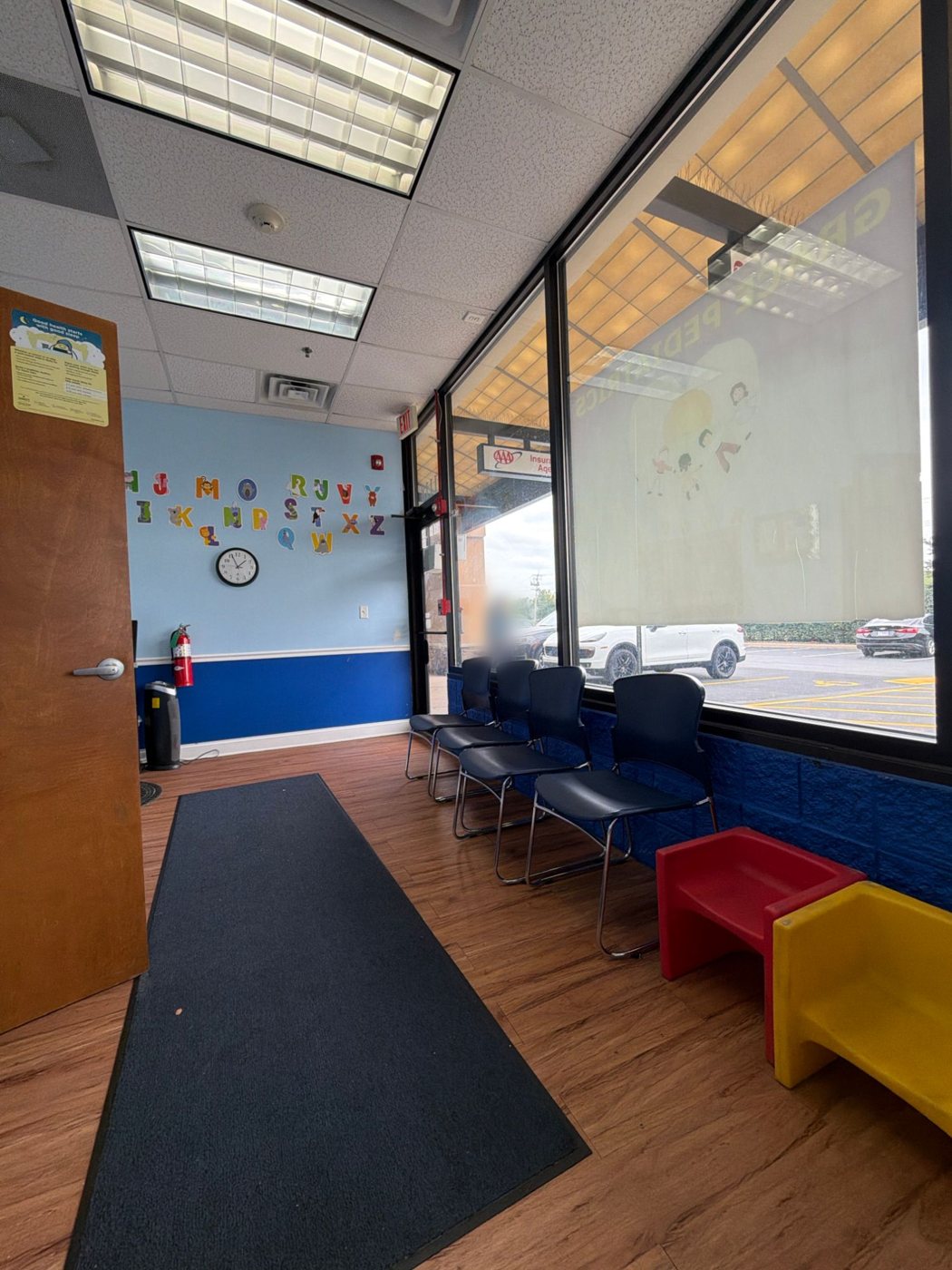 Waiting room with chairs by the front window